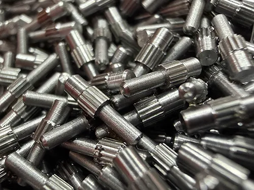 Knurled molded-in threaded stud for plastic housings, medical enclosures, and molded assembly fastening.