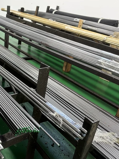 Bar stock inventory for automatic screw machine production, including brass C360 and free-cutting steel rods for repeat turned parts.