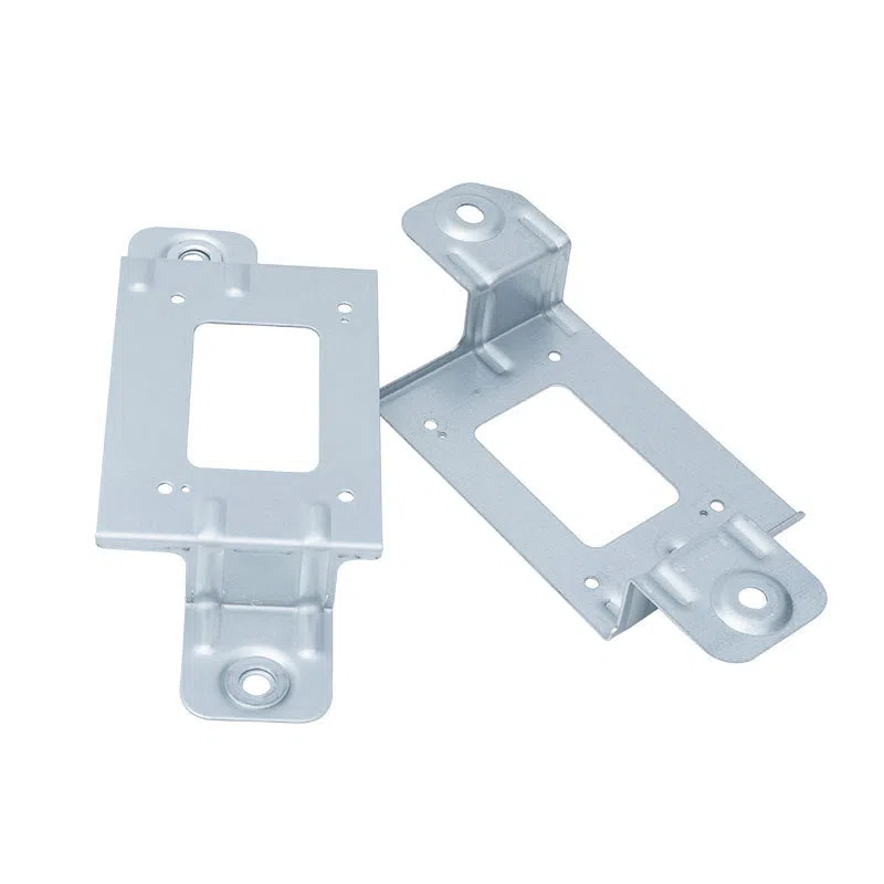 Precision-stamped galvanized steel mounting brackets with custom rectangular cutouts and circular installation holes, manufactured by FIWOK using progressive die metal stamping presses.