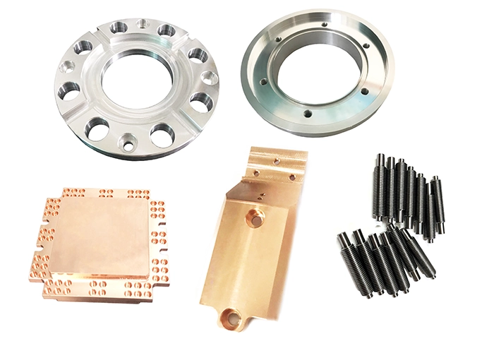 Representative as-machined aluminum, copper, and steel CNC parts with visible machining surfaces.